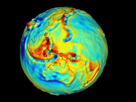 A gif shows areas of high and low gravity plotted around a map of the globe, which it rotates around.