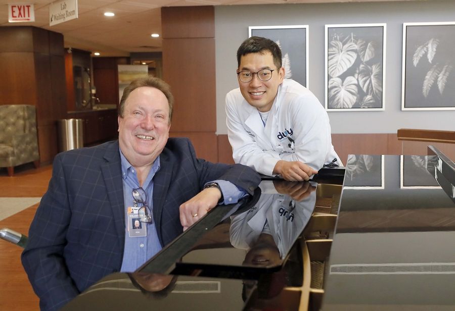 Philip Spencer and David Kim bring their love of music to the Edward Hospital lobby.  Spencer plays every Tuesday and Thursday, and Kim comes by most Thursday mornings, his time permitting.
