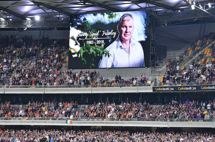 billboard showing Danny Frawley on screening at football ground