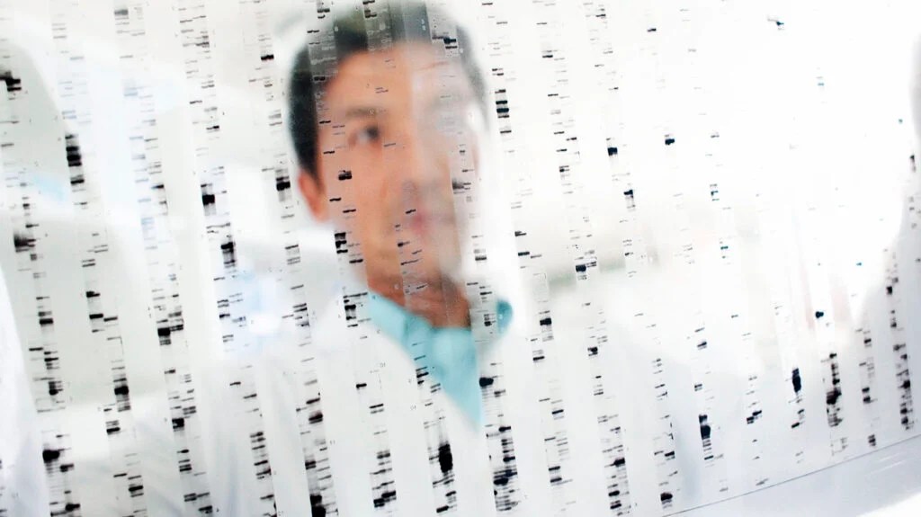 researcher examining genetic sequences