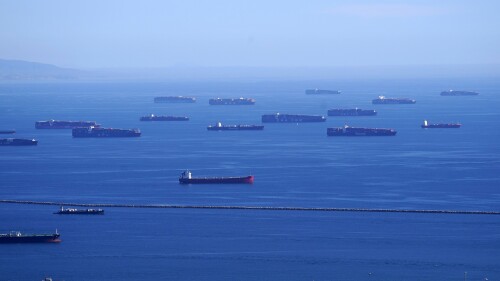 FILE - Cargo ships line up outside the Port of Los Angeles, Tuesday, Feb. 23, 2021, in Los Angeles.  Maritime nations are finalizing a plan to reduce shipping sector emissions to zero by around 2050 on Thursday, July 6, 2023, but experts warn that the deal falls short of what is needed to prevent the climate catastrophe.  (AP Photo/Mark J. Terrill, Files)